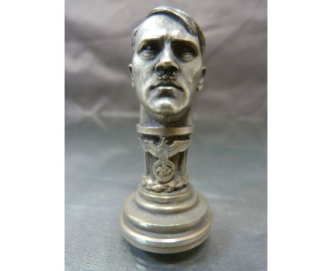 German ink stamp - The handle form of Hitler's Head mounted onto a column with the Eagle holding a Swastika Wreath below. The