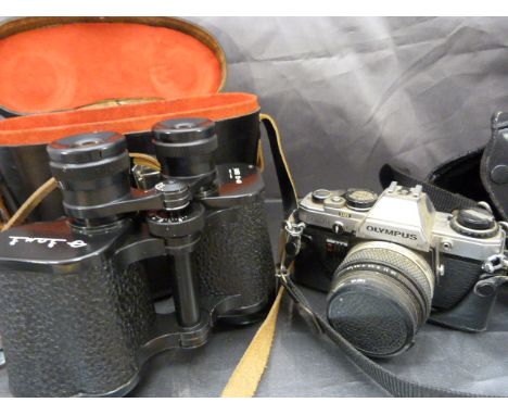 An Olympus OM10 cased camera and a pair of Russian Military binoculars in superb condition BOMB.