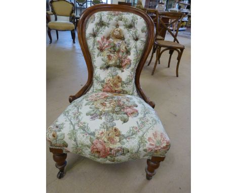 Victorian re-upholstered button back nursing chair on mahogany frame.