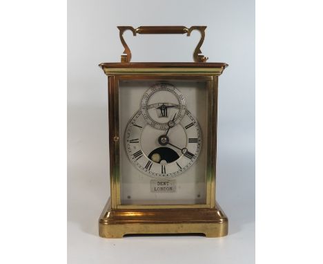 A Goliath Brass Cased Repeating Carriage Clock with twin fusee chain driven movement, the silvered dial with moon phase and s
