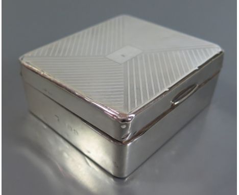 An Elizabeth II Silver Pin Dish Sheffield 1977, George VI Silver Cigarette Box London 1939 and egg shaped pepper with loaded 
