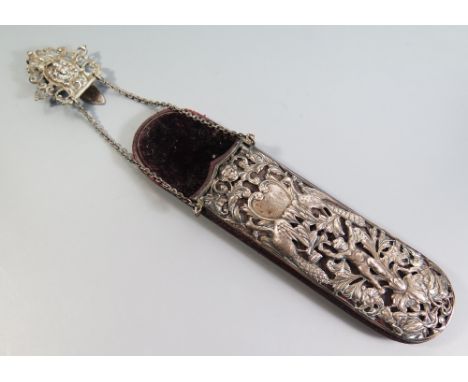 A Victorian Silver Mounted Spectacles Case, the pierced mount decorated with putto, peacocks, monkeys and foliate scroll work