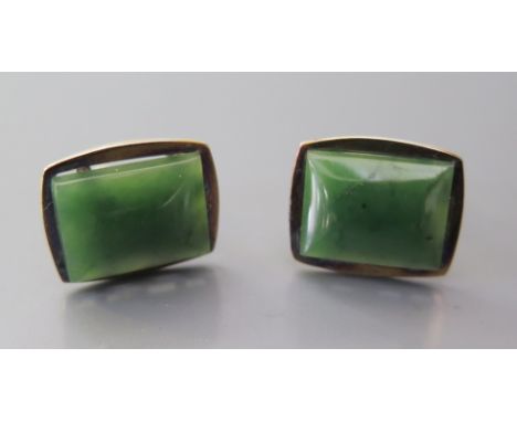 A Pair of Sterling Silver Gilt Cufflinks set with jadeite 