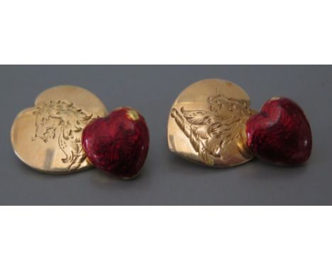 A Pair of 18ct Gold Heart Shaped Cufflinks, the fronts engraved with a lion's head and backs with crimson guilloché enamel, b