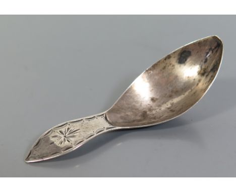 A Nineteenth Century Dutch Silver Caddy Spoon with bright cut decoration, Amsterdam, 9g 