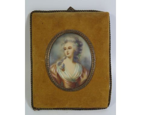 A Continental Miniature half length portrait of a lady in a plush frame 