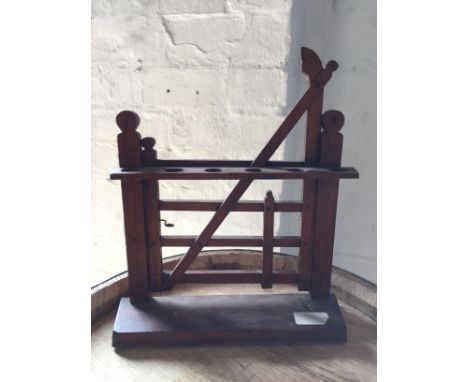 An Edwardian Novelty Wooden Pipe Rack for six pipes, in the form of a five bar gate, c.1910, 31cm high.