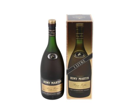 A bottle of Remy Martin cognac champagne. 40%, 1l, in the original packaging