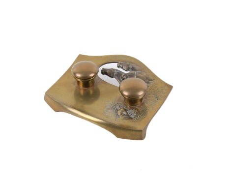An Art Nouveau brass inkwell. Decorated with an image of three horses and a fox, stamped 'Geschutzt' to the underside, L18cm