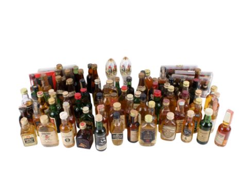 A collection of miniature bottles of alcohol. Including Martell cognac, Glenlivet Scotch Whisky, DYC whisky, Lochan Ora and m