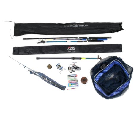 An assortment of fishing equipment. Including rods, nets, tackle, a wooden reel, Daiwa 7000C, boxed Red Gill Squid Jig, etc. 