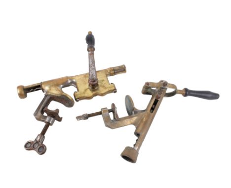The ACME brass bar mounted corkscrew with turned wooden handle also with another. Engraved "the ACME" both sides H40cm x W39c