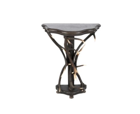 A 20th century deer antler console table. With a curved and shaped top in stained wood supported by three deer horns, the bas