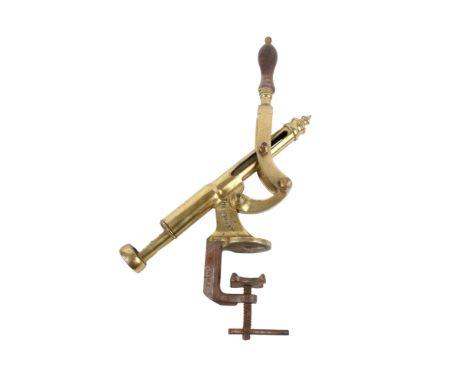 The Swift brass bar mounted corkscrew with turned wooden handle. Engraved "THE SWIFT" to both sides. H52cm x W48cm x D7cm.