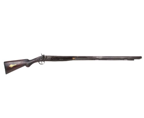 A Single barrel percussion shotgun. No makers name 16 gauge bore in reasonable condition light pitting brass patch box in sto