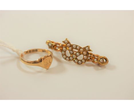An 18 carat gold ring and a bar brooch set with seed pearls 
