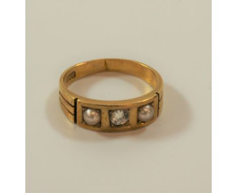 An Edwardian three stone diamond and pearl ring set in 18 carat gold 