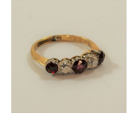 A five stone ruby and diamond ring 