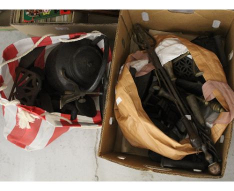 A large quantity of vintage household and kitchenalia metal items to include flat irons, Victorian shoe lasts, black kettle, 