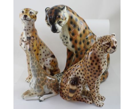 A graduated group of three ceramic leopards, height of largest 41cm and a recumbent giraffe by Lomonosov Russian Porcelain Ma