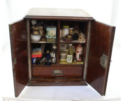 A late Victorian double-fronted tabletop cabinet opening to reveal vintage medical supplies, height 42.5cm. CONDITION REPORT 