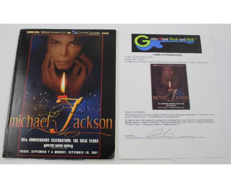 A Michael Jackson signed original '30th Anniversary Celebration - The Solo Years' programme from the 2001 Madison Square Gard