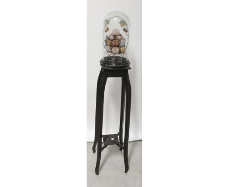 A Victorian glass dome on stand containing a faux fruit display, height 37cm and an ebonised early/mid-20th century jardinièr