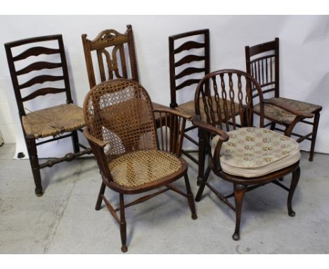 A Victorian oak hall chair, carved openwork back to turned supports, two ladder-back Lancashire chairs with rush seats, one o