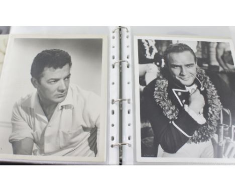 A collection of 10 x 8 black and white vintage film star portrait and movie scenes to include Clint Eastwood as 'The Man With