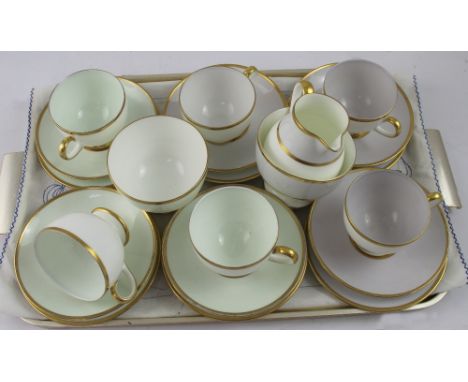 A Wedgwood mid-20th century six-setting tea set, three cups, saucers and side plates in pale green and three in purple, with 