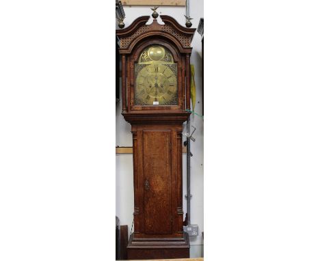 A late 18th century oak longcase clock by Nathaniel Pilmer of Wellington, the brass arched dial with broken swan neck pedimen