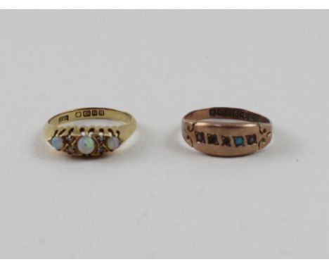 An 18ct gold three stone white opal ring, siz N1/2, and a 9ct turquoise example, Size O1/2, approx combined 4.4g (2).