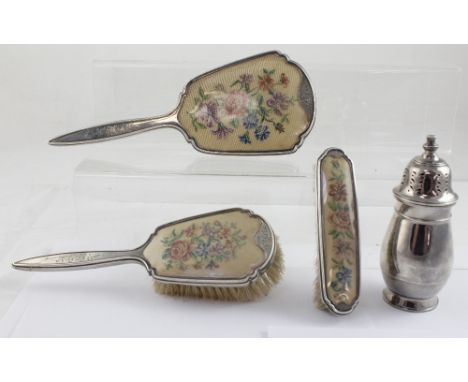 Three pieces of George VI hallmarked silver dressing table furniture to include matching hand brush, hand mirror and smaller 