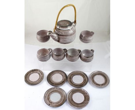 A lilac-covered studio pottery tea set of six cups, six saucers and teapot with bamboo handle, height 28cm including handle, 