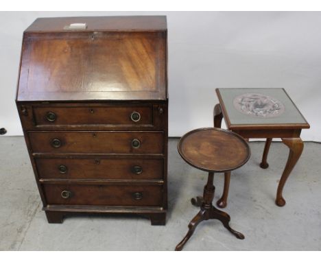 A walnut veneered bureau of four drawers, height 94cm, a dish-top wine table with vase turned support and a gros point tapest