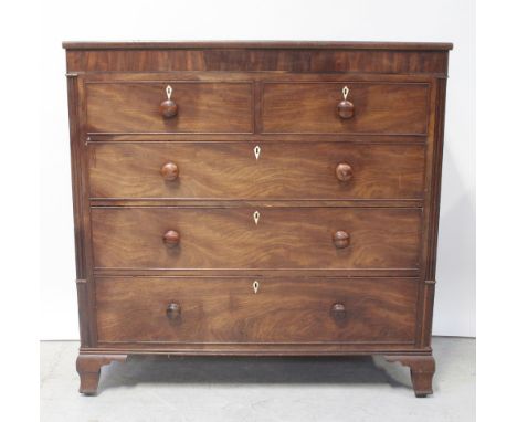 A George III mahogany caddy topped chest of two over three drawers raised on ogee bracket feet, height 131cm.
