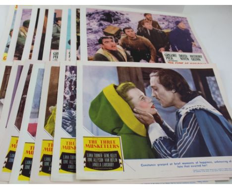 A collection of original vintage 11 x 14ins cinema lobby advertising posters to include 'The Guns of Navarone' x8, 'The Three