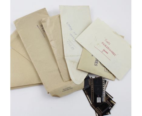A collection of 35mm film reel sections and frames for vintage films including 'That's Entertainment', 'The Wizard of Oz' and