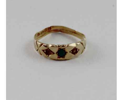 An Edwardian yellow metal dress ring set with emerald and pearl, marked 22ct (lacking one pearl), size R, approx 2.6g.