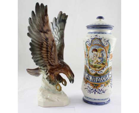 A replica of an 18th century Majolica style apothecary jar, hand painted with figure of a putti with pestle and mortar and th