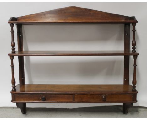 A 19th century Douglas Fir wall-mounted shelving rack, the lower shelf with two frieze drawers, width 91.5cm. CONDITION REPOR