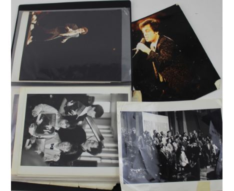 A folder containing a quantity of ephemera relating to Billy Joel, mainly photographs to include original press photographs o