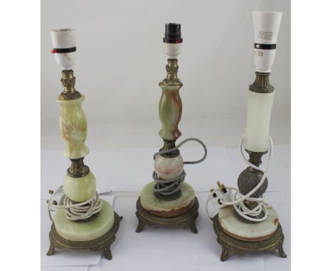 A pair of green onyx and gilt metal lamp bases and a similar further example, height of each approx 38cm (3).