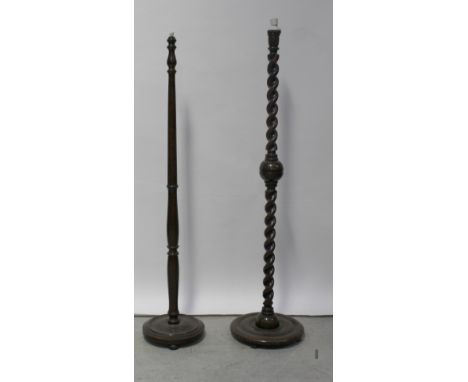 An early 20th century mahogany standard lamp, wrythen column with central carved ball to circular stepped base, height 150cm 