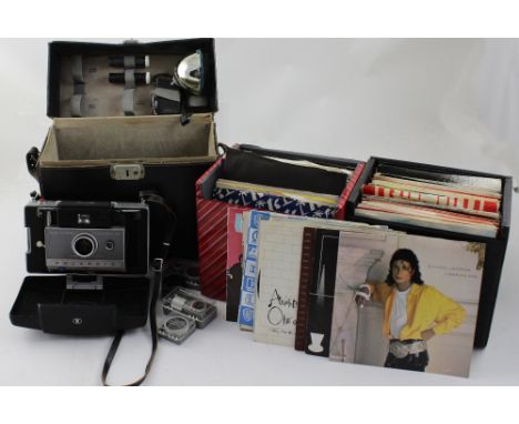 A small collection of vinyl to include Rod Stewart, Lionel Richie etc, and a boxed Polaroid camera.