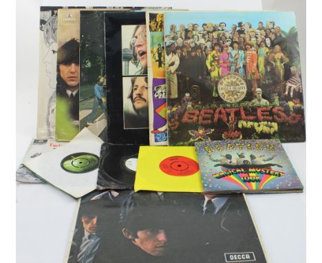 A collection of Beatles singles and LPs to include 'Old Brown Shoe', 'Hey Jude', 'Lady Madonna', 'Twist and Shout', 'Magical 