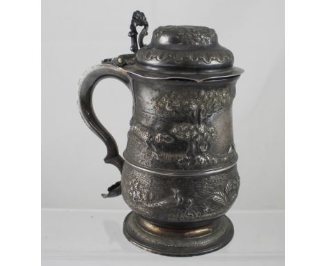 A George III and later silver tankard with later chased landscape with hunting dogs and game birds, date marks to the base, W
