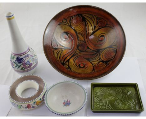 A large orange Poole Aegean pattern dish, diameter 34cm and three pieces of the floral Poole including a bottle vase and an u