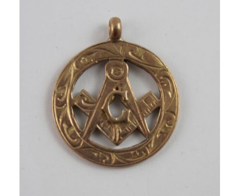 A 9ct gold Masonic pendant in the form of the square and compass within a garter border, Birmingham 1920-21, height including