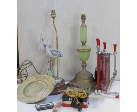 Two vintage lamp bases, one as a pair of bisque cranes, the other a green onyx example, a 1960s chrome and red fireside compa